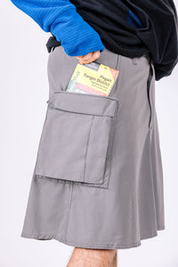 Gray hiking skirt for men with close up view of pocket space that fits a full-size hiking map.