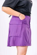 Side view of pink hiking skirt with pockets for women.